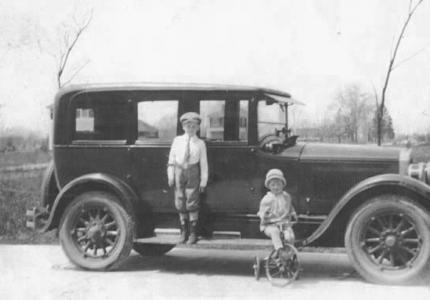 Bruce Bockstanz and brother in front of a 1924 5-passenger Buick Sedan. 1
