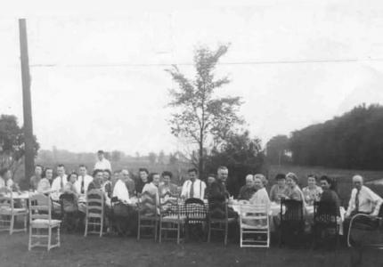 Large group of people sitting outdoors 1943 1