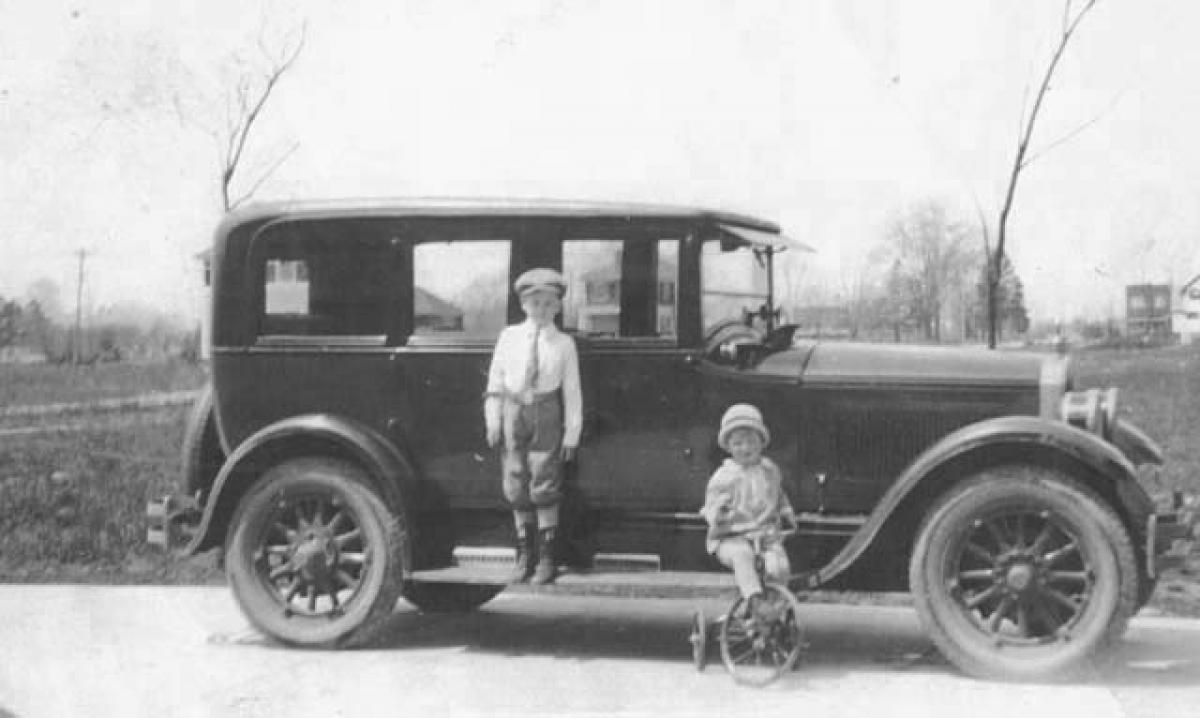 Bruce Bockstanz and brother in front of a 1924 5-passenger Buick Sedan. 1