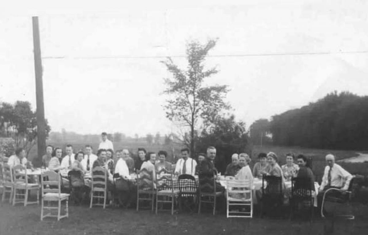 Large group of people sitting outdoors 1943 1